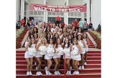 The RedSteppers pose on the steps up to Memorial Stadium.
